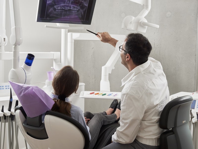 Dentist pointing at X-ray